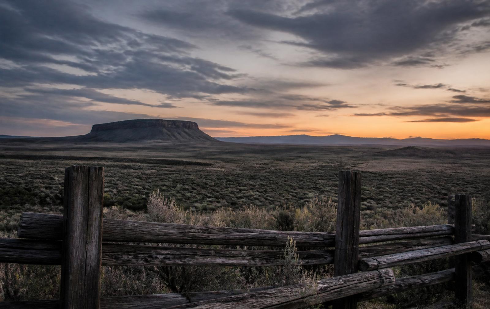 American ranch at dawn with mesa on the horizon